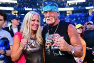 Terry Bollea posing with his third and current wife at a WWE event last year (Image via Julio Aguilar/Getty Images)